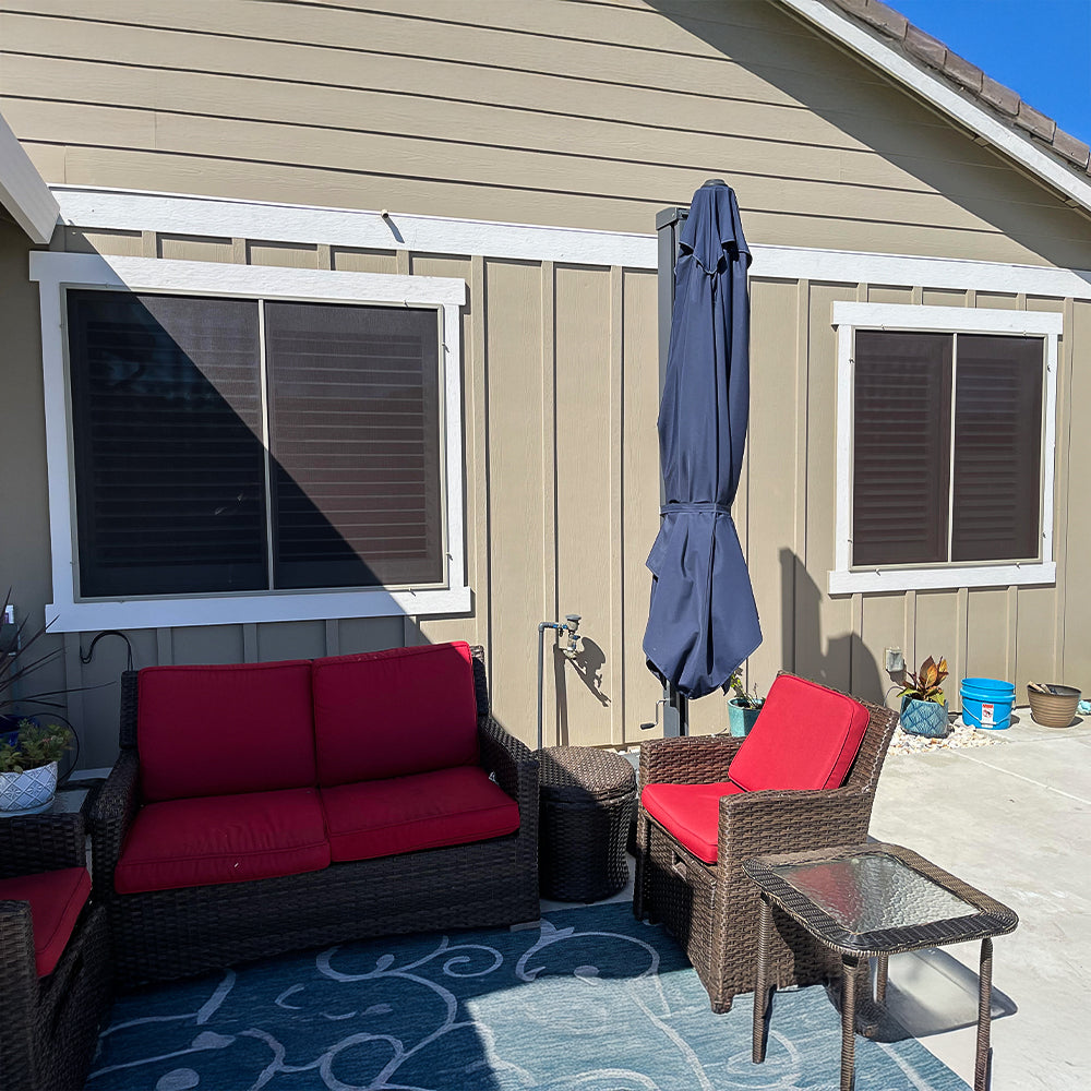 brown solar screens installed on patio windows providing shade and heat reduction
