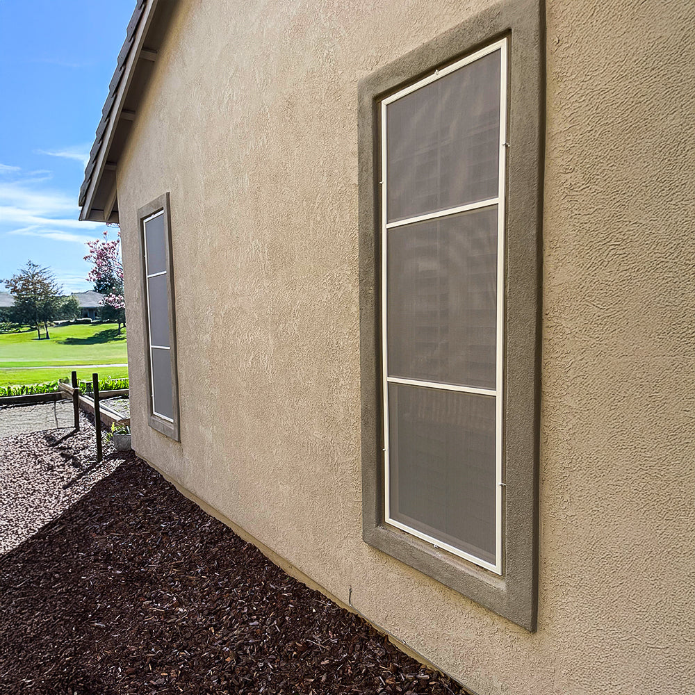 dusk grey solar screens installed on side windows reducing heat and maintaining natural light inside home