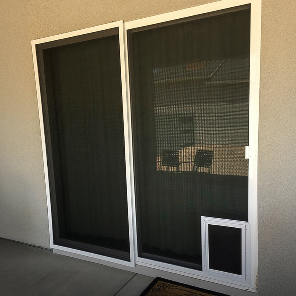 sliding screen door with built in pet door installed on patio sliding glass door