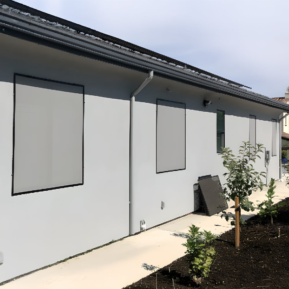 dusk grey solar screens installed on side of house reducing heat and glare from sunlight